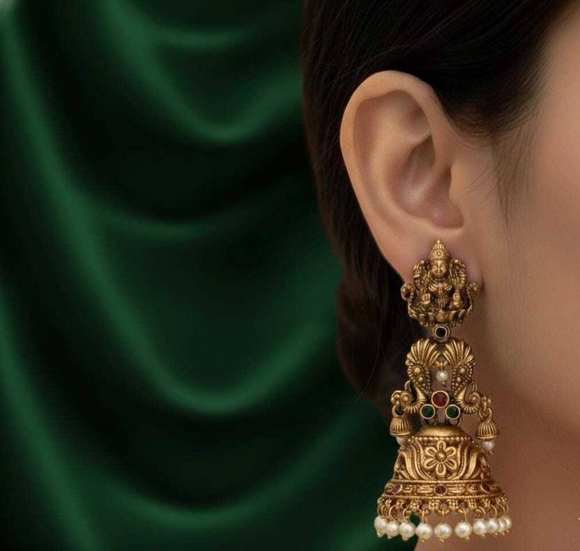 Traditional gold jhumka earrings with Ganesha